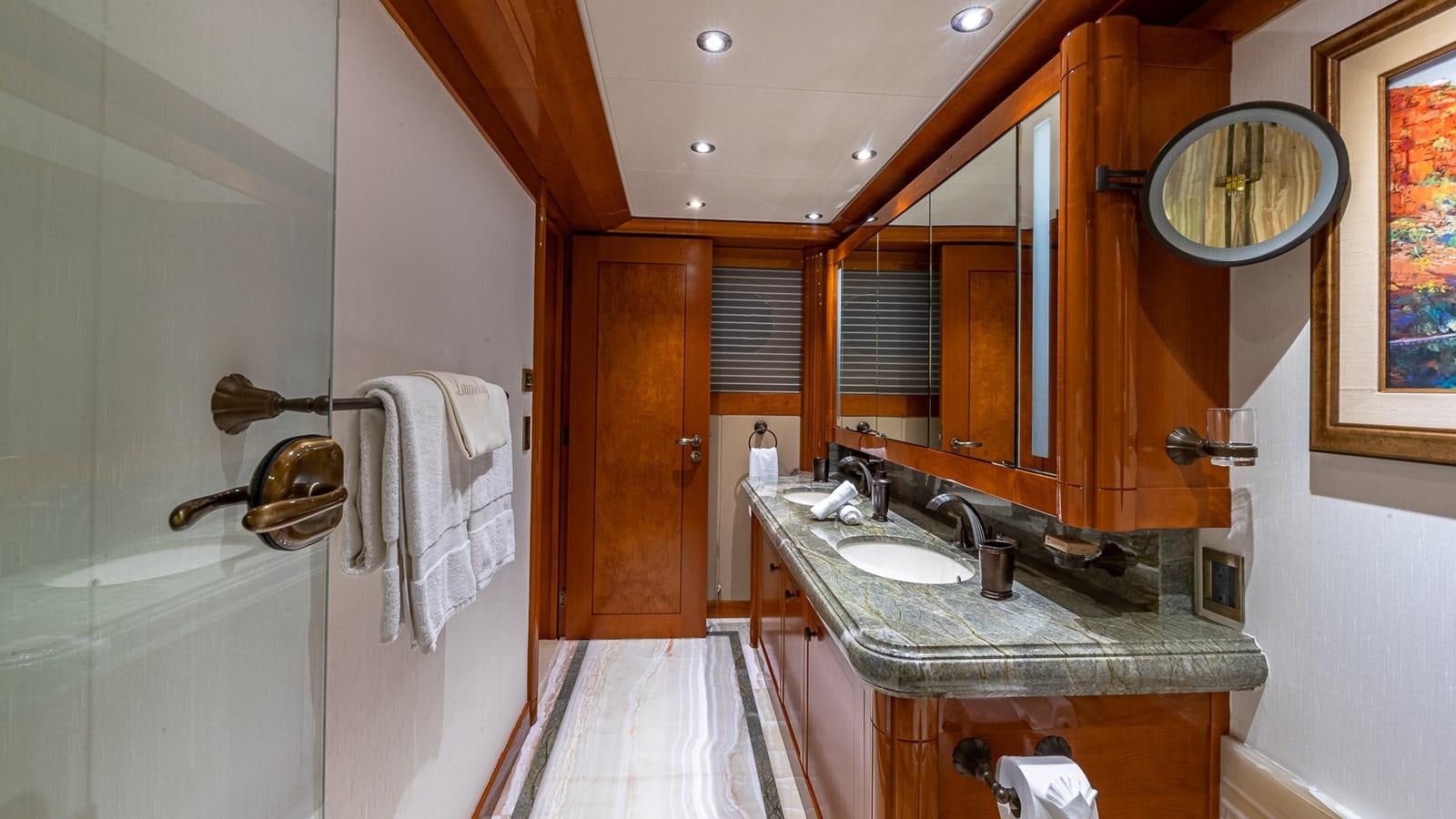 a bathroom with a sink and a mirror aboard AS YOU WISH Yacht for Charter