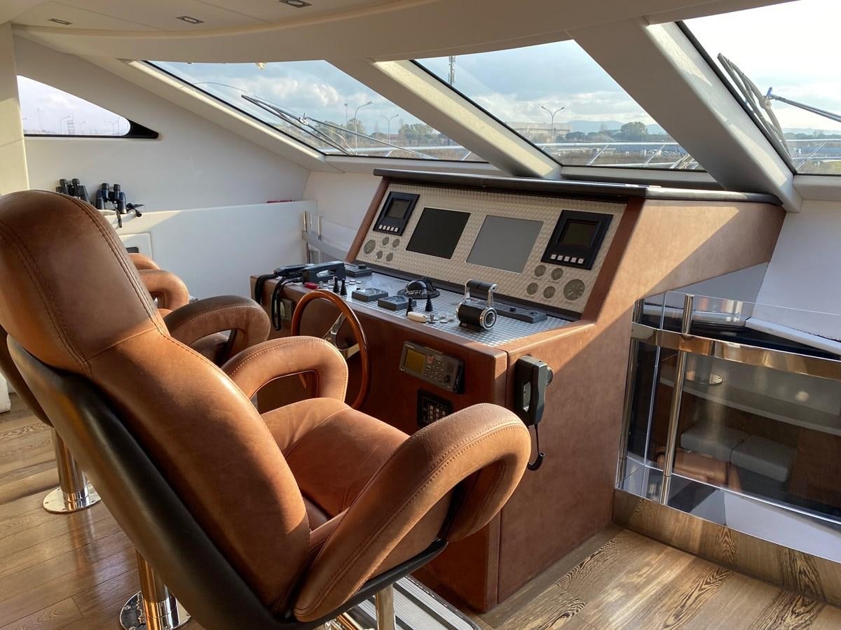 a room with chairs and a table aboard GINEVRA Yacht for Sale