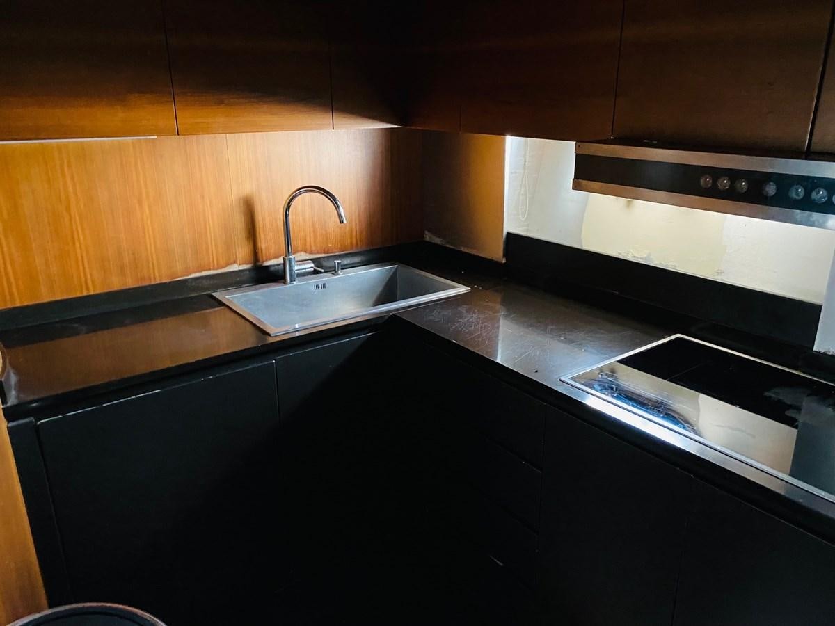 a kitchen with a sink and a stove aboard GINEVRA Yacht for Sale