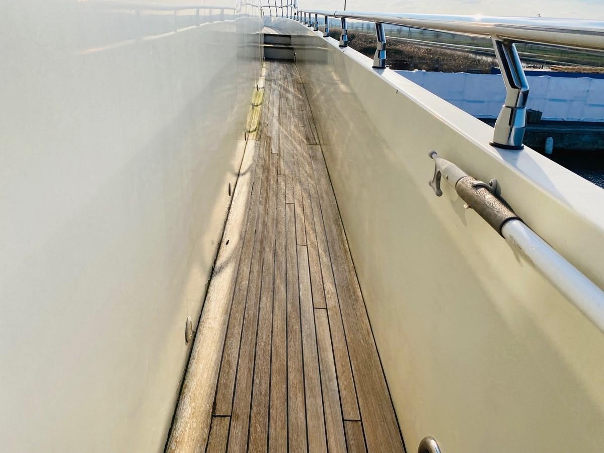 a long wooden dock aboard GINEVRA Yacht for Sale