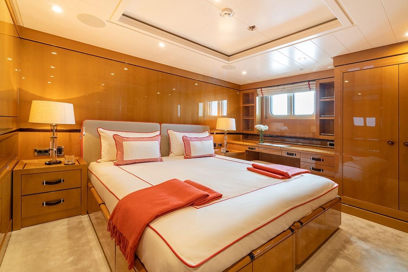 a large bedroom with a bed aboard DEEP BLUE Yacht for Sale