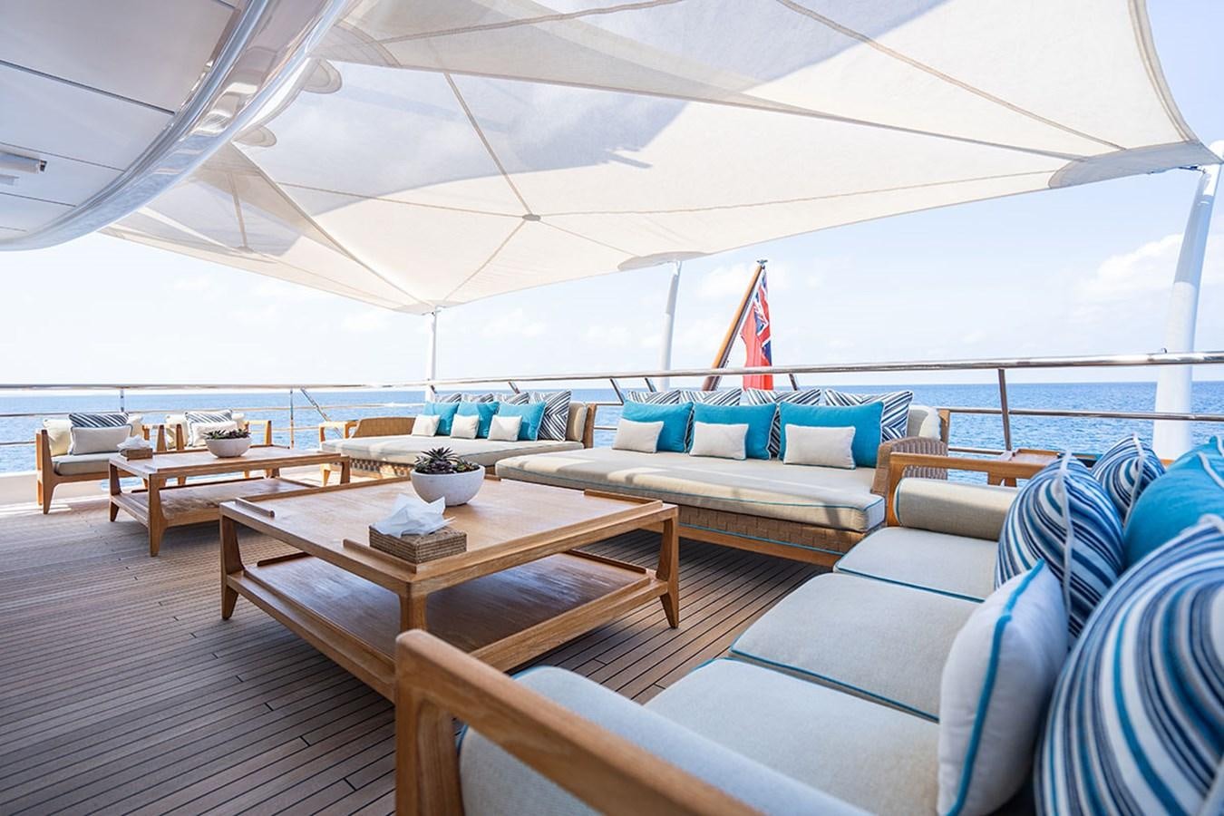 a large tent with a table and chairs aboard DEEP BLUE Yacht for Sale