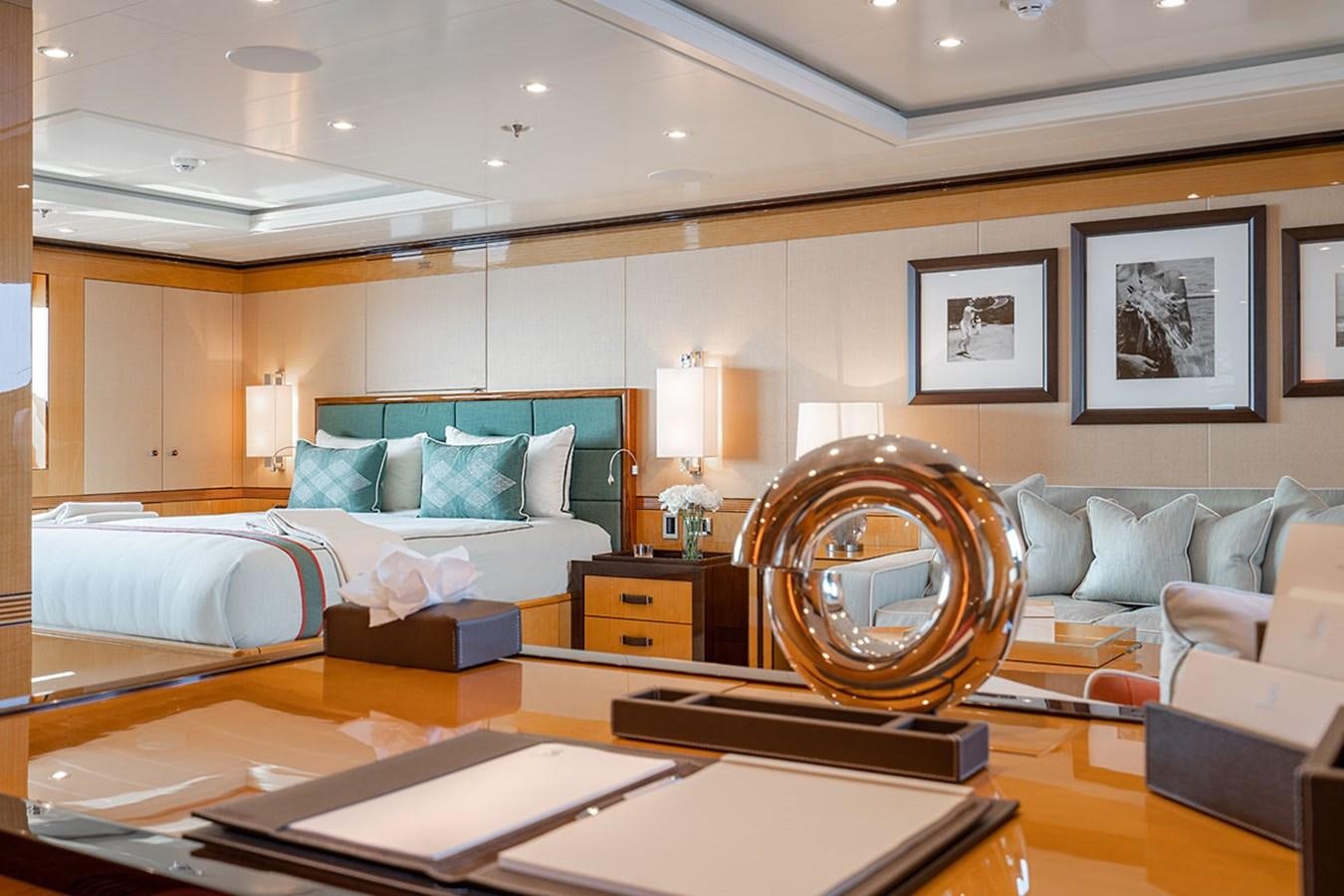 a room with a bed and a couch aboard DEEP BLUE Yacht for Sale