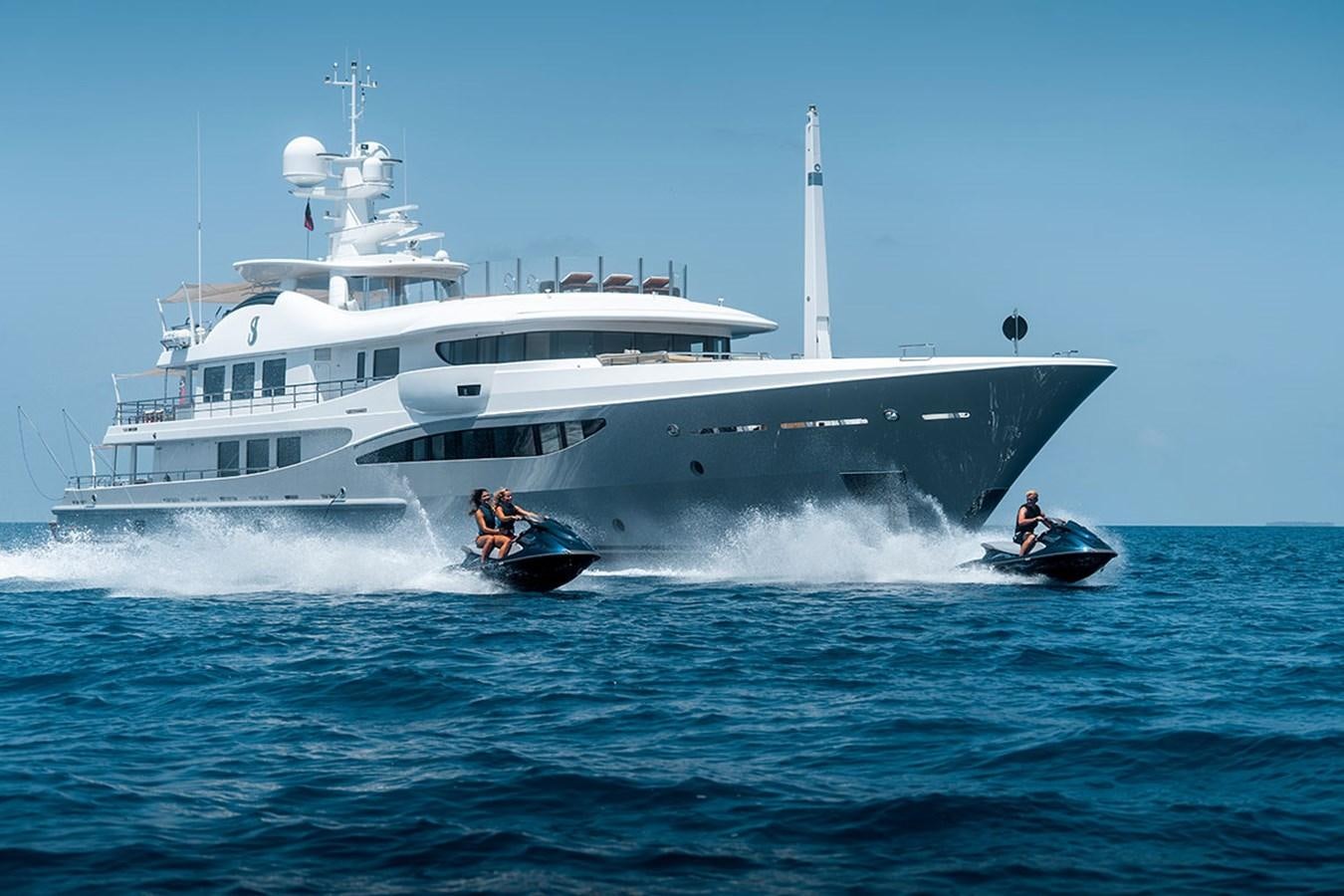 a boat with a motor boat in the background aboard DEEP BLUE Yacht for Sale