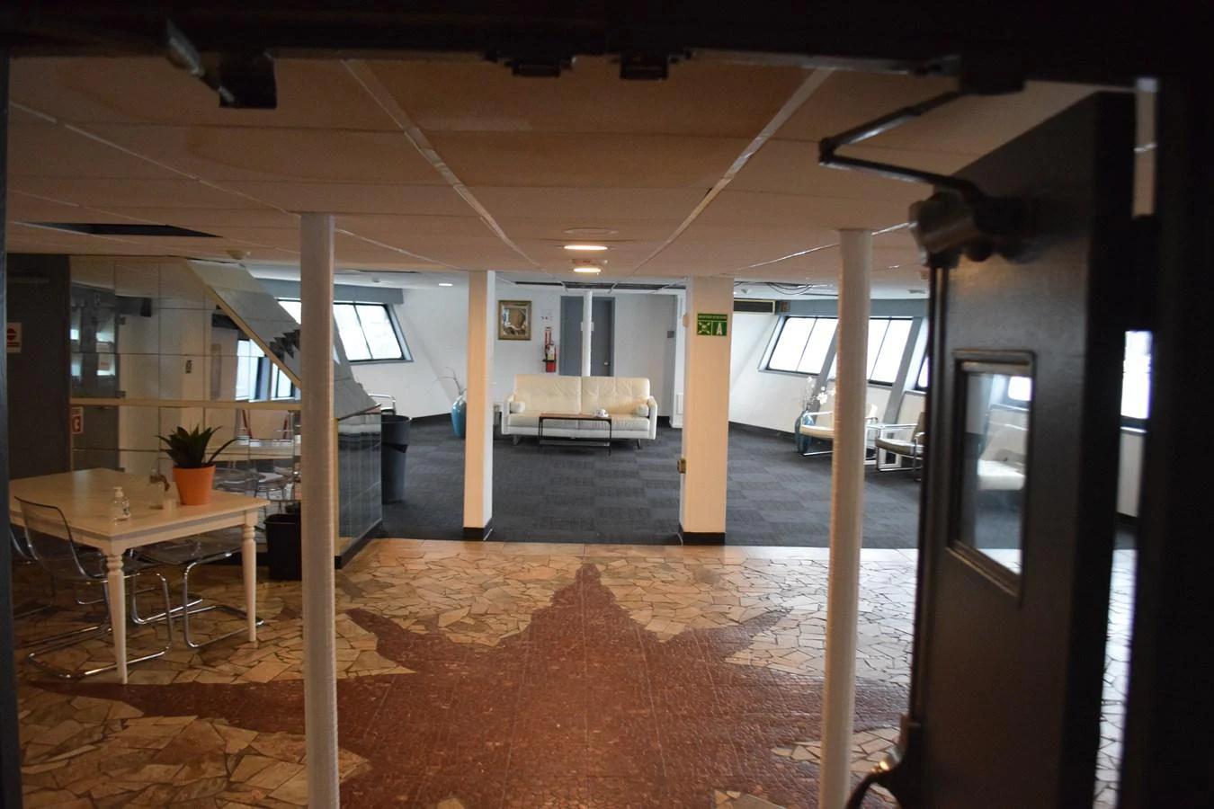 a room with a table and chairs aboard MAGIC SPIRIT Yacht for Sale