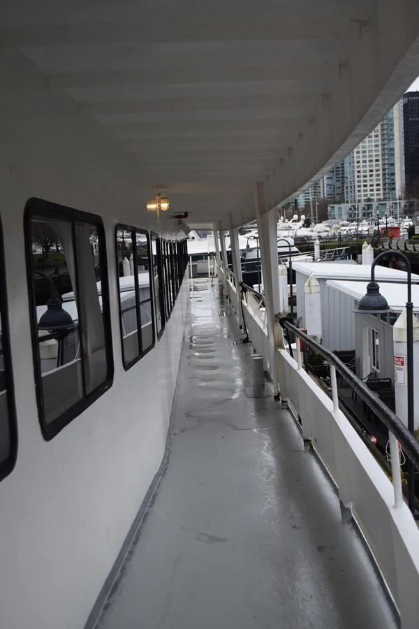 a long hallway with a light on the side aboard MAGIC SPIRIT Yacht for Sale