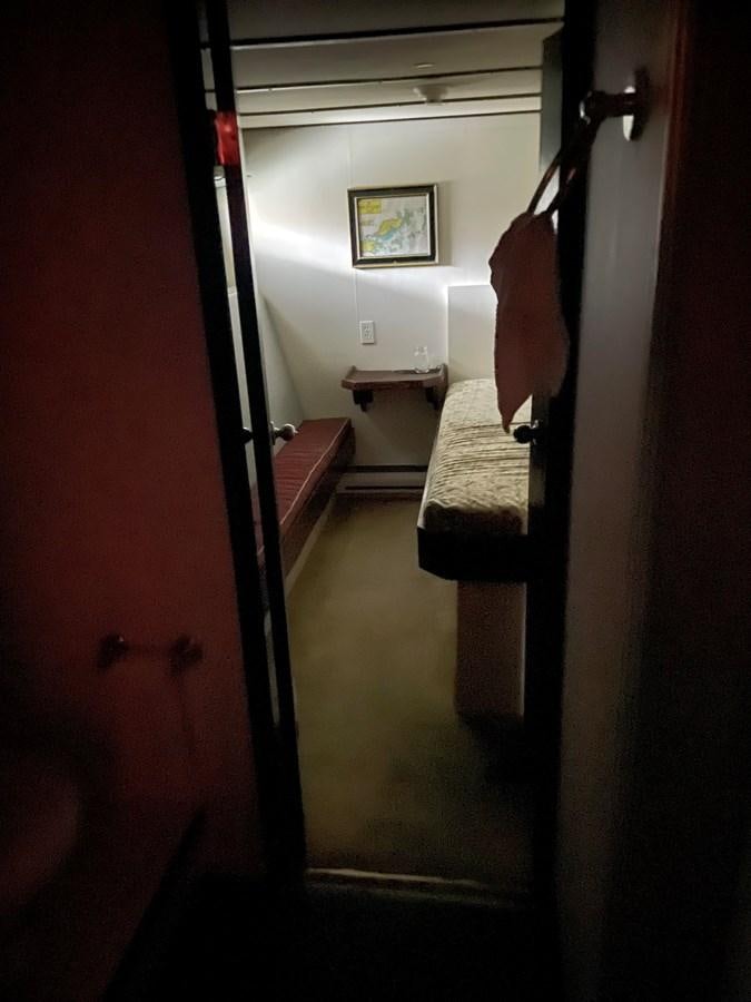 a hallway with a door and a mirror aboard MAGIC MOMENT Yacht for Sale