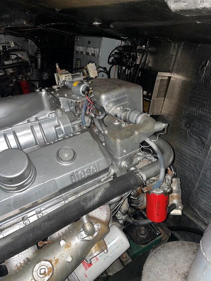 a machine with a large metal cylinder aboard MAGIC MOMENT Yacht for Sale