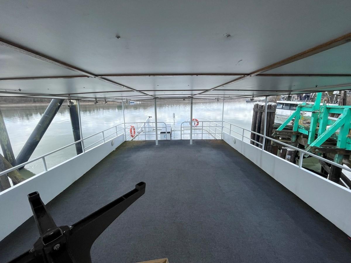 a large room with a large window aboard MAGIC MOMENT Yacht for Sale