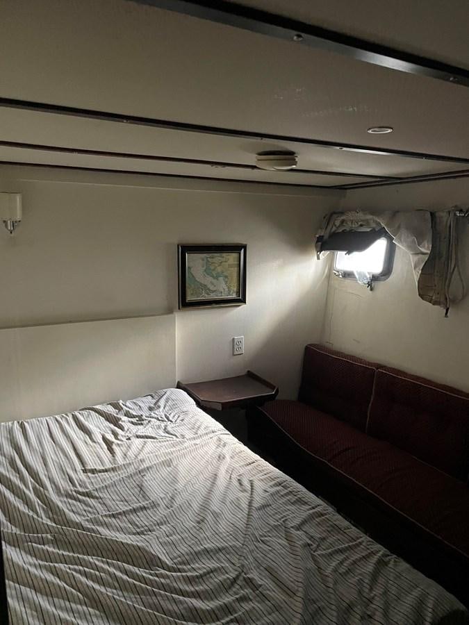 a couple of beds in a hotel room aboard MAGIC MOMENT Yacht for Sale