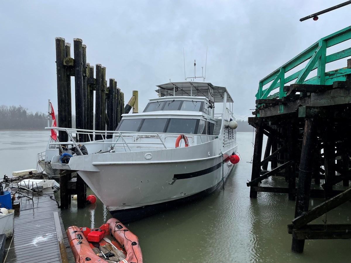 a boat docked at a pier aboard MAGIC MOMENT Yacht for Sale