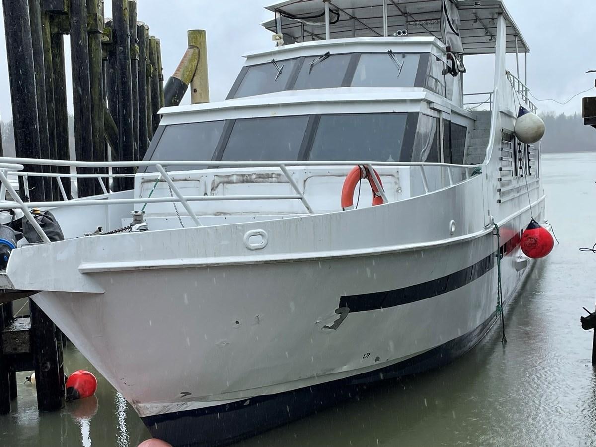 a white boat in the water aboard MAGIC MOMENT Yacht for Sale