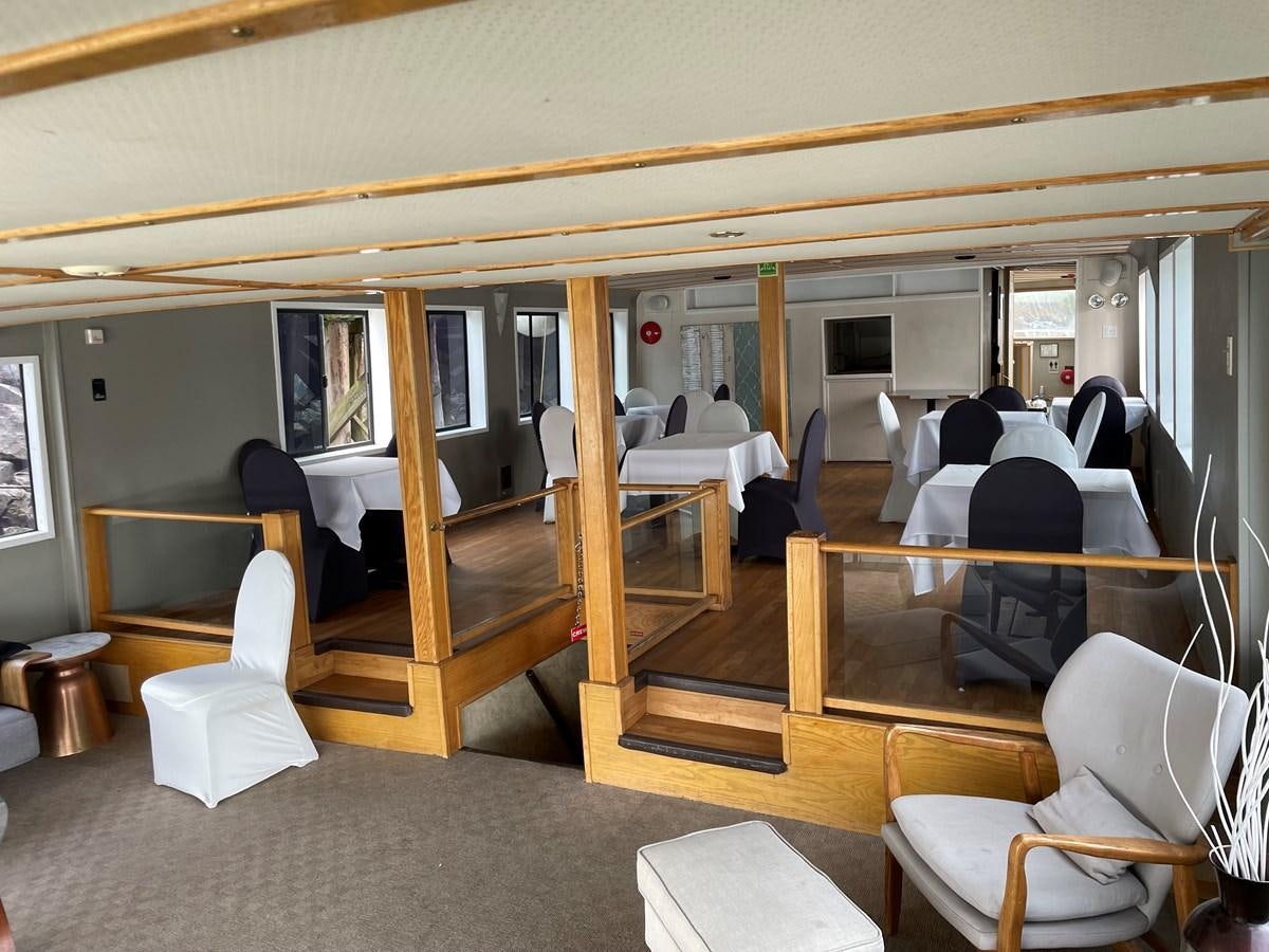 a person sitting in a chair aboard MAGIC MOMENT Yacht for Sale