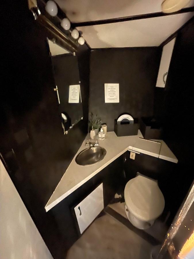 a bathroom with a sink and toilet aboard MAGIC MOMENT Yacht for Sale