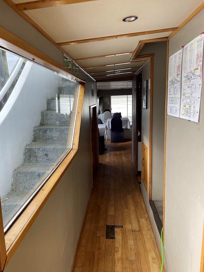 a hallway with stairs aboard MAGIC MOMENT Yacht for Sale