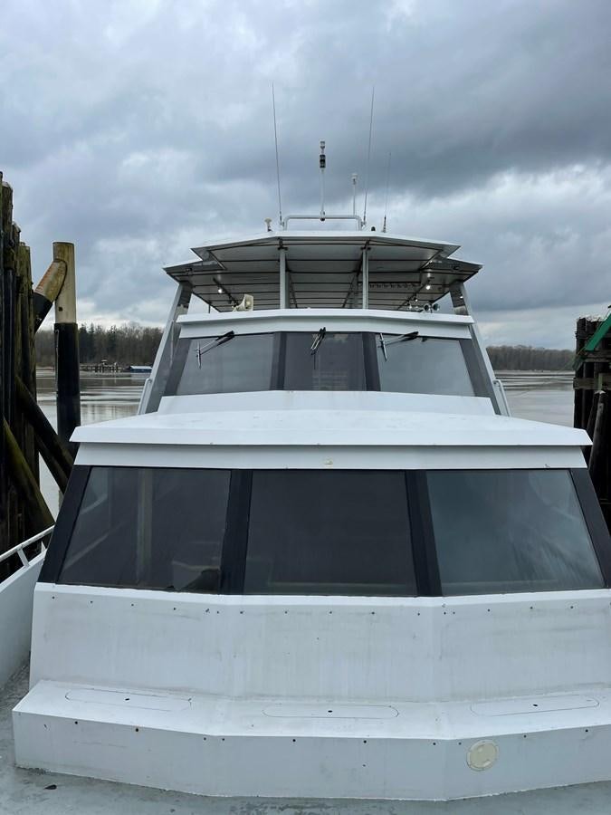 a white boat with a white roof aboard MAGIC MOMENT Yacht for Sale