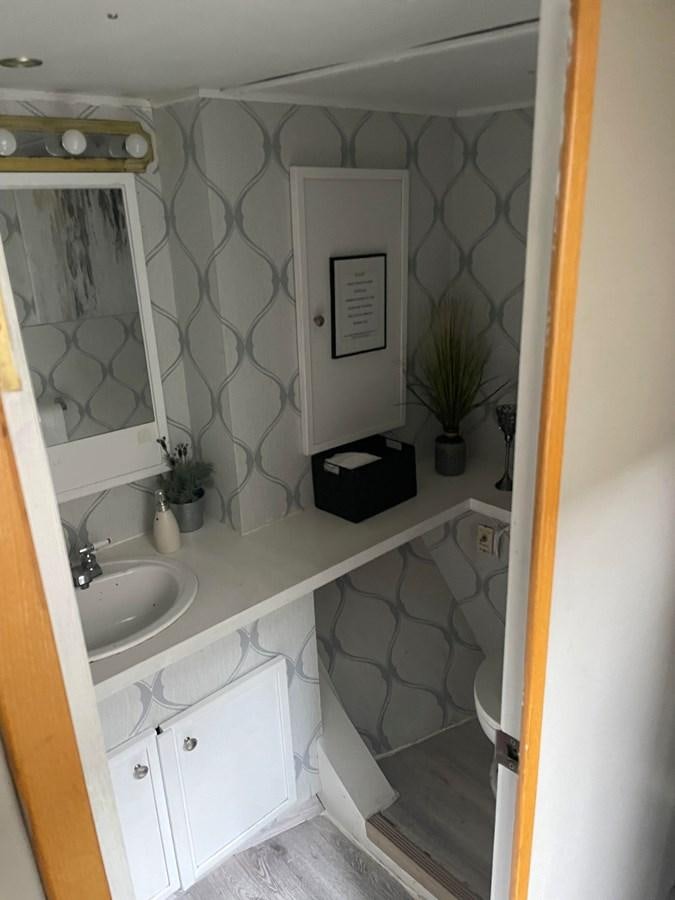 a bathroom with a sink and a toilet aboard MAGIC MOMENT Yacht for Sale