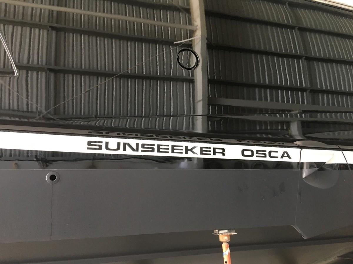 a sign on a building aboard OSCA Yacht for Sale