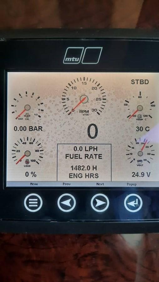 a close up of a digital clock aboard OSCA Yacht for Sale