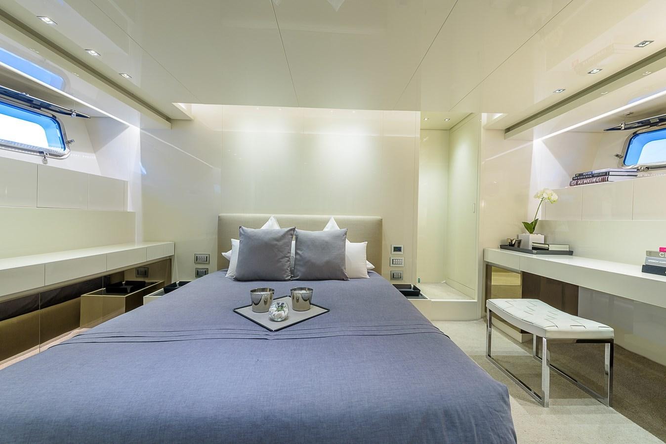 a bed with a blue sheet aboard MUSHA Yacht for Sale