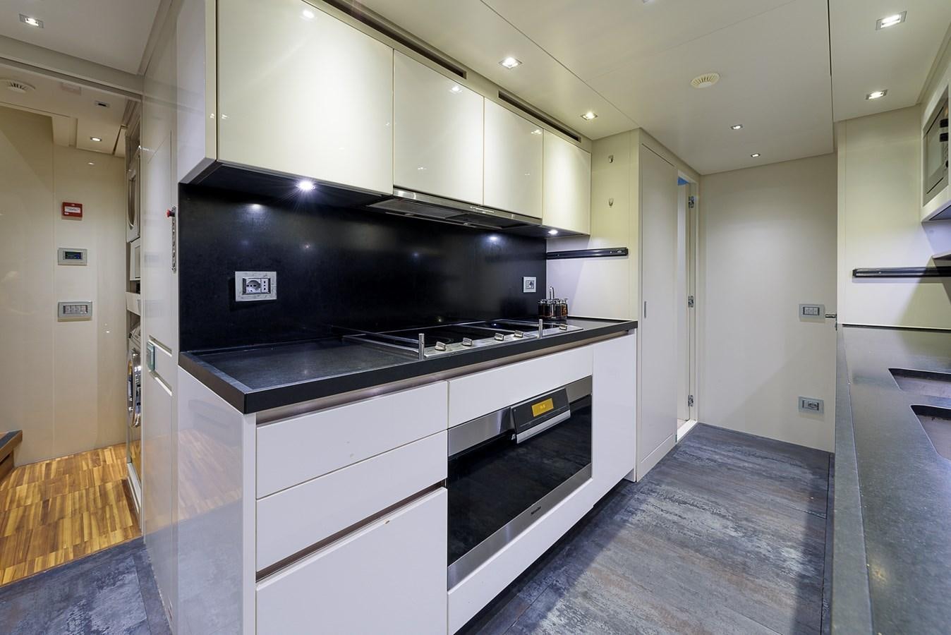 a kitchen with a stove and a counter aboard MUSHA Yacht for Sale