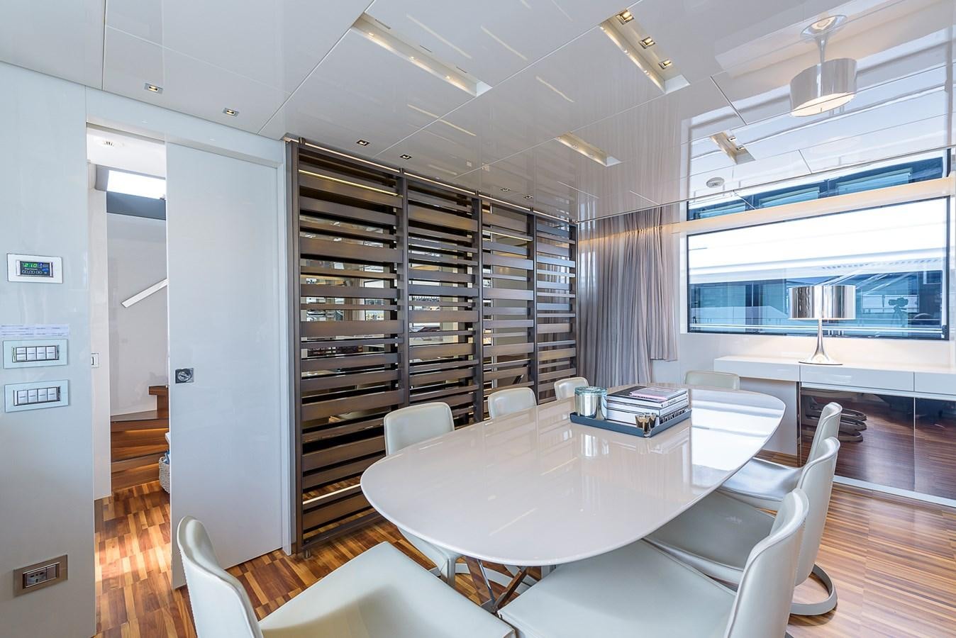 a room with a table chairs and a window aboard MUSHA Yacht for Sale