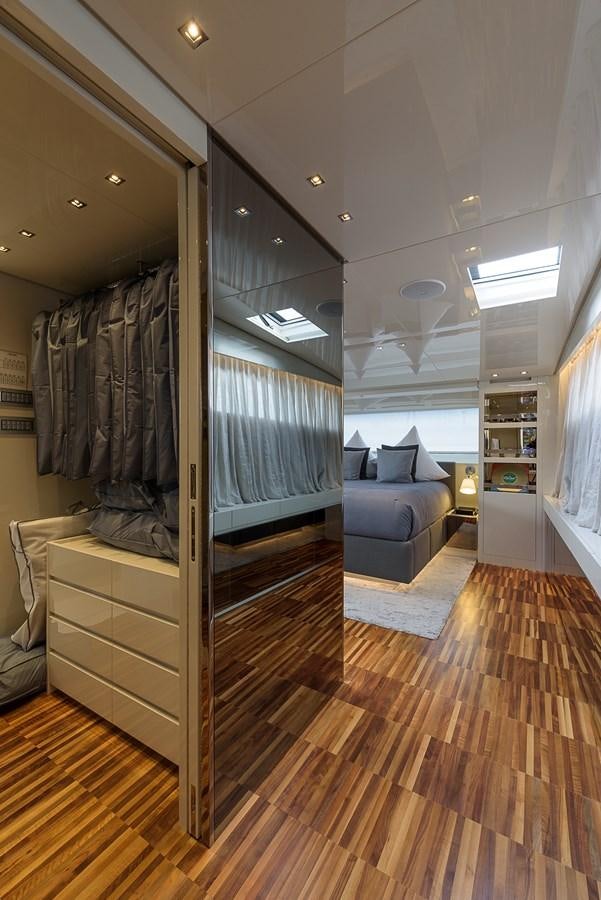 a room with a large mirror and a wood floor aboard MUSHA Yacht for Sale