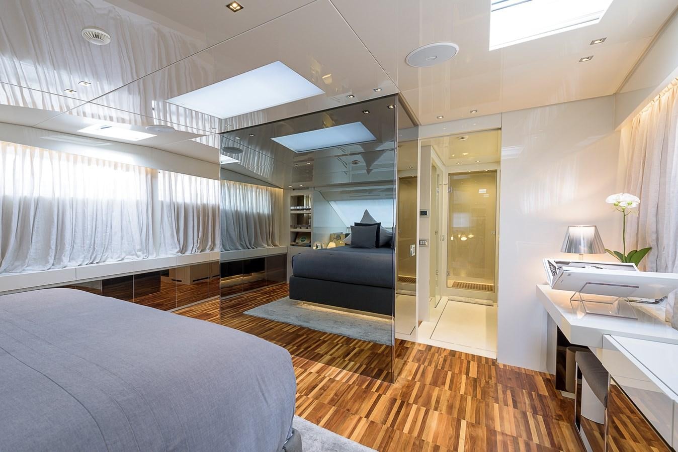 a room with a bed and a desk aboard MUSHA Yacht for Sale