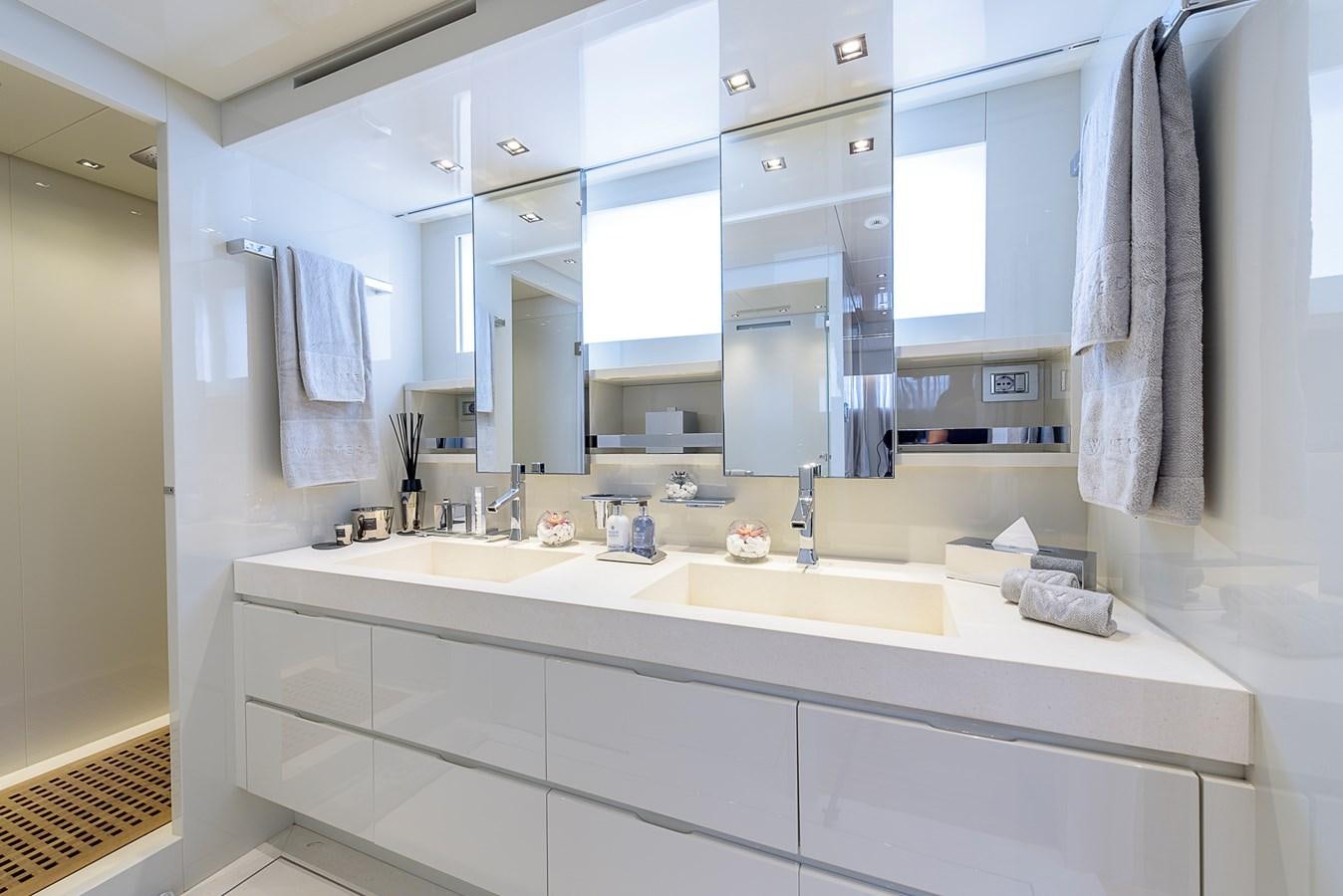 a bathroom with a large mirror aboard MUSHA Yacht for Sale
