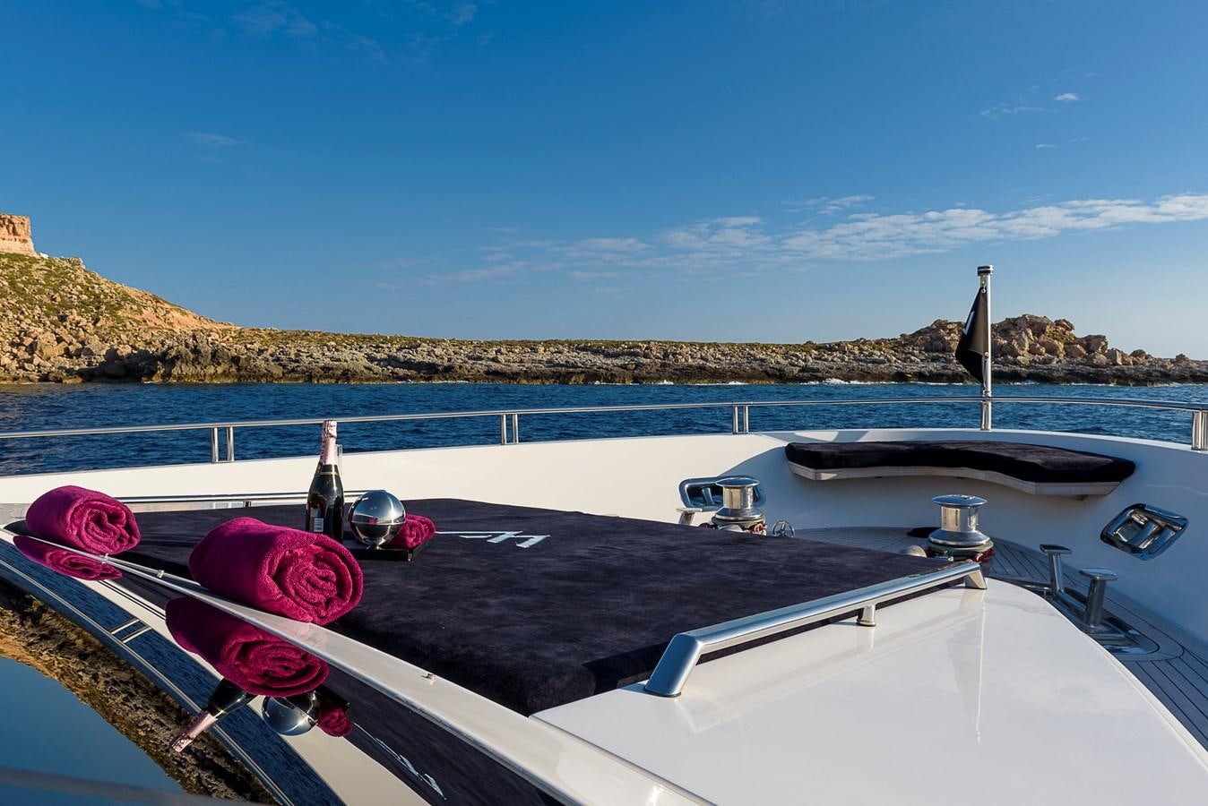 a boat with a person on it aboard MUSHA Yacht for Sale