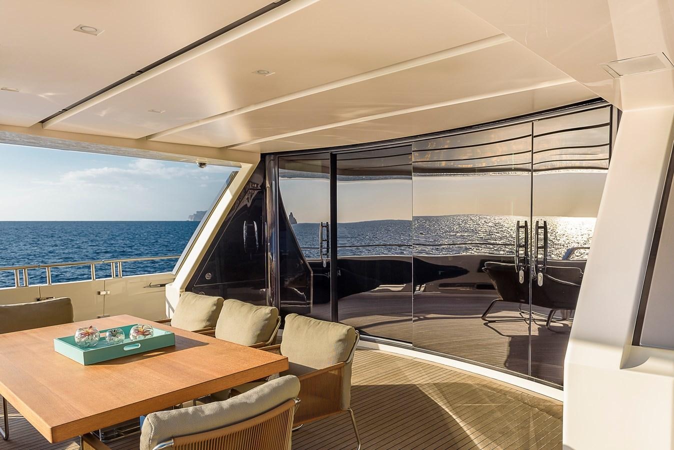 a room with a table and chairs aboard MUSHA Yacht for Sale