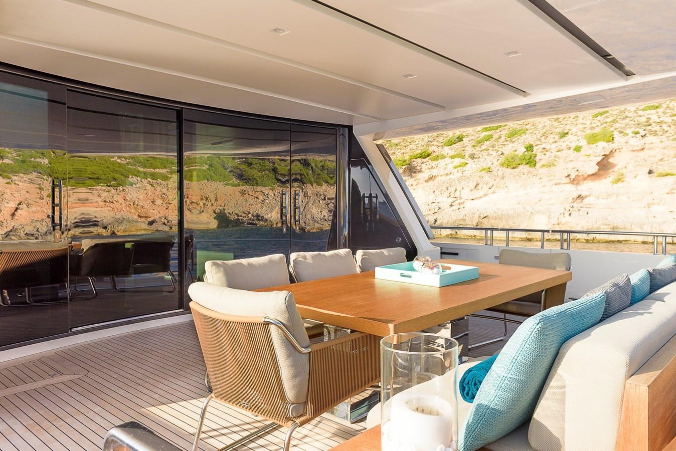 a living room with a large window aboard MUSHA Yacht for Sale