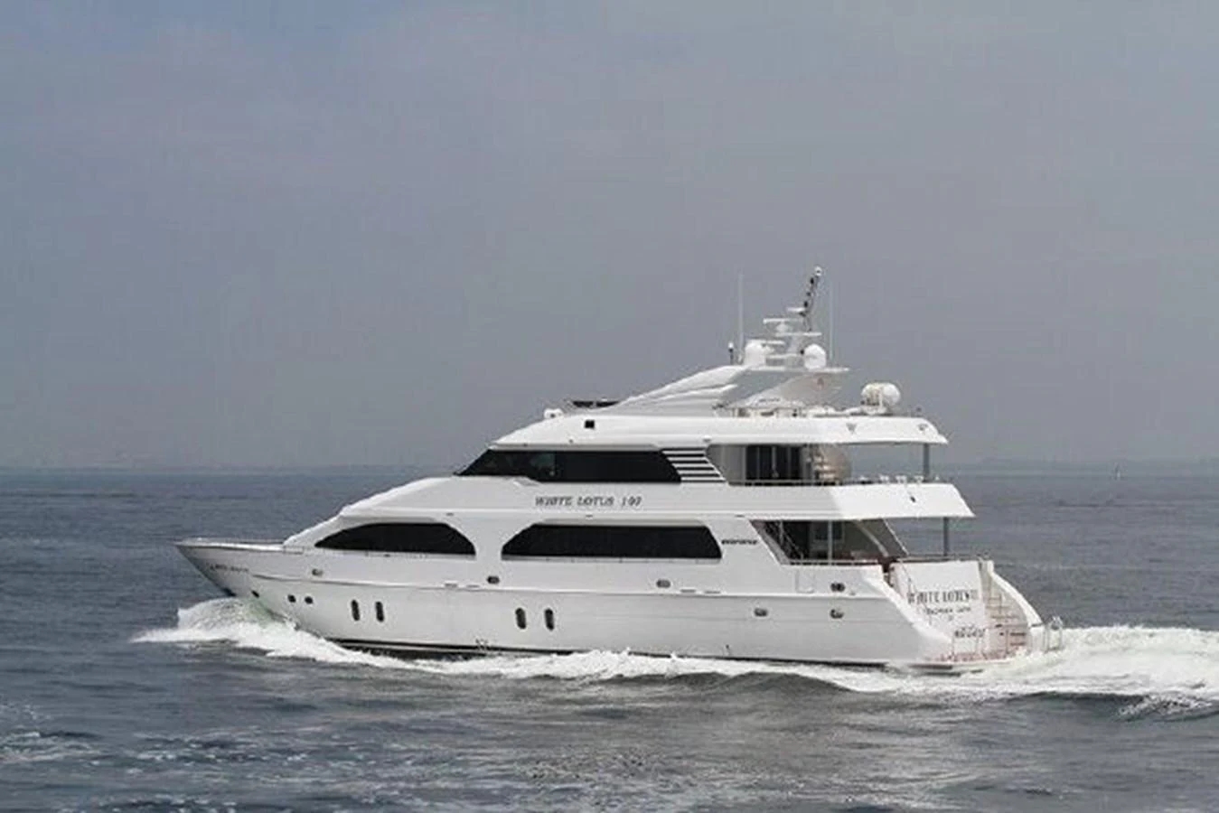 a white yacht in the water aboard WHITE LOTUS Yacht for Sale