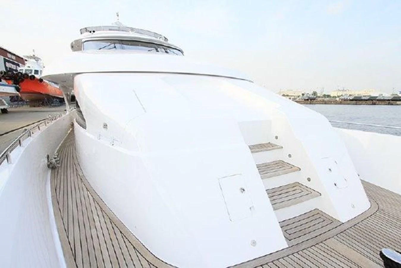 a white boat on a dock aboard WHITE LOTUS Yacht for Sale