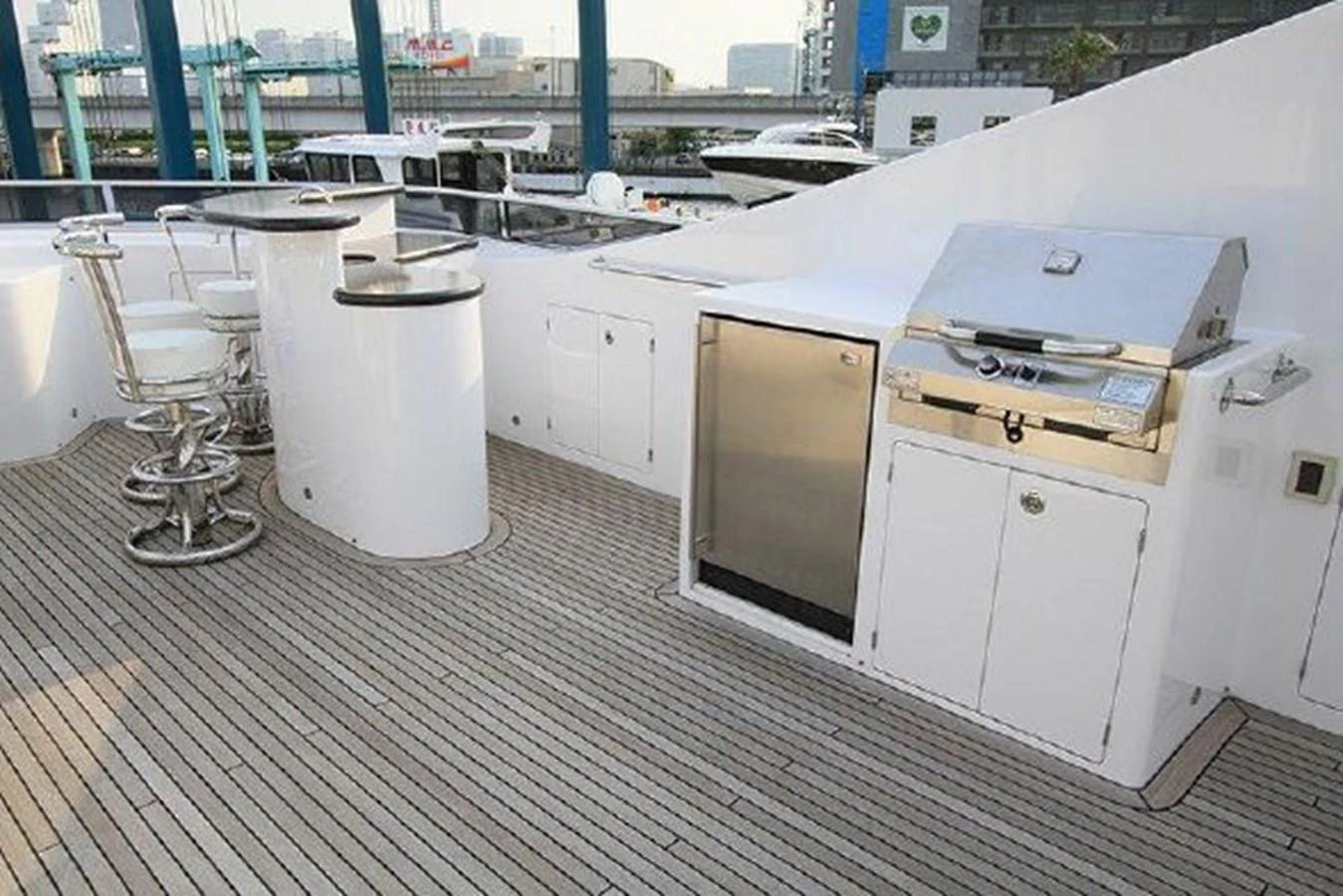 a room with white cabinets and a white container on a wooden floor aboard WHITE LOTUS Yacht for Sale