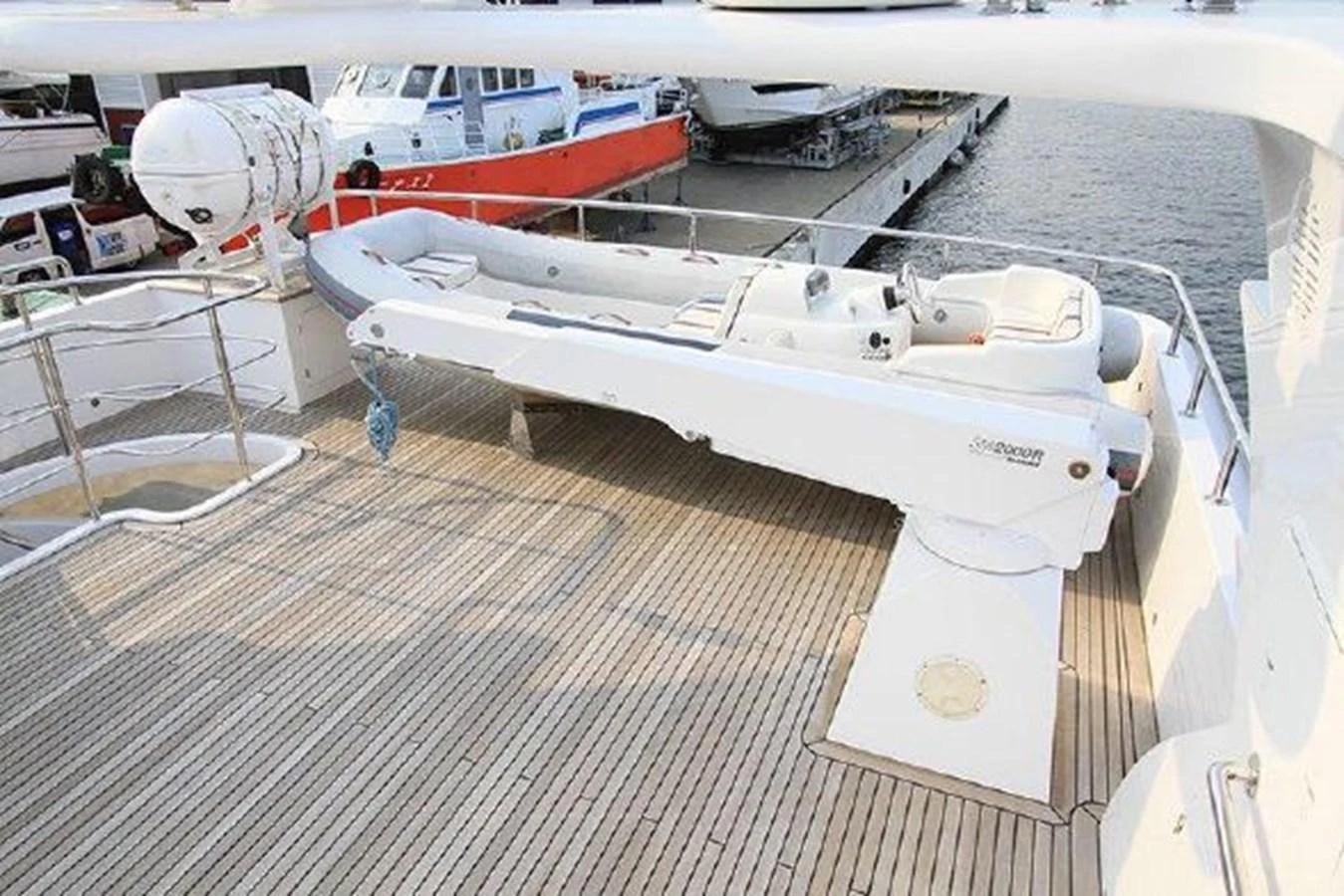 a row of white boats aboard WHITE LOTUS Yacht for Sale