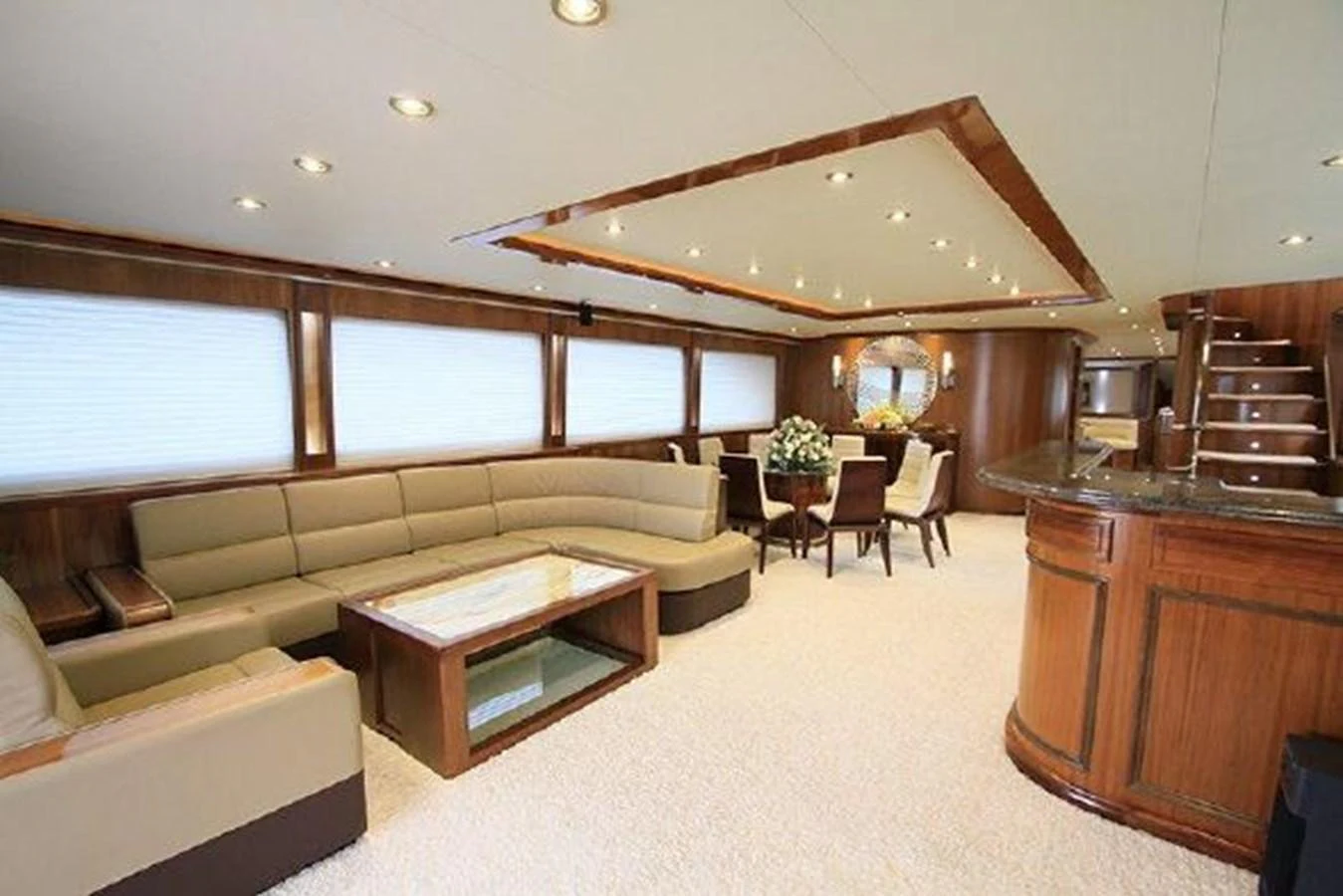 a living room with a couch and a table aboard WHITE LOTUS Yacht for Sale