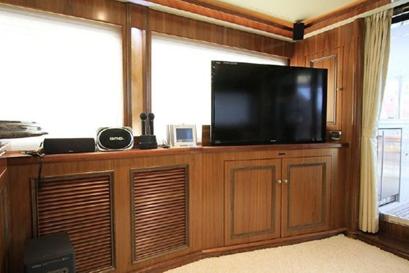 a room with a tv and cabinets aboard WHITE LOTUS Yacht for Sale