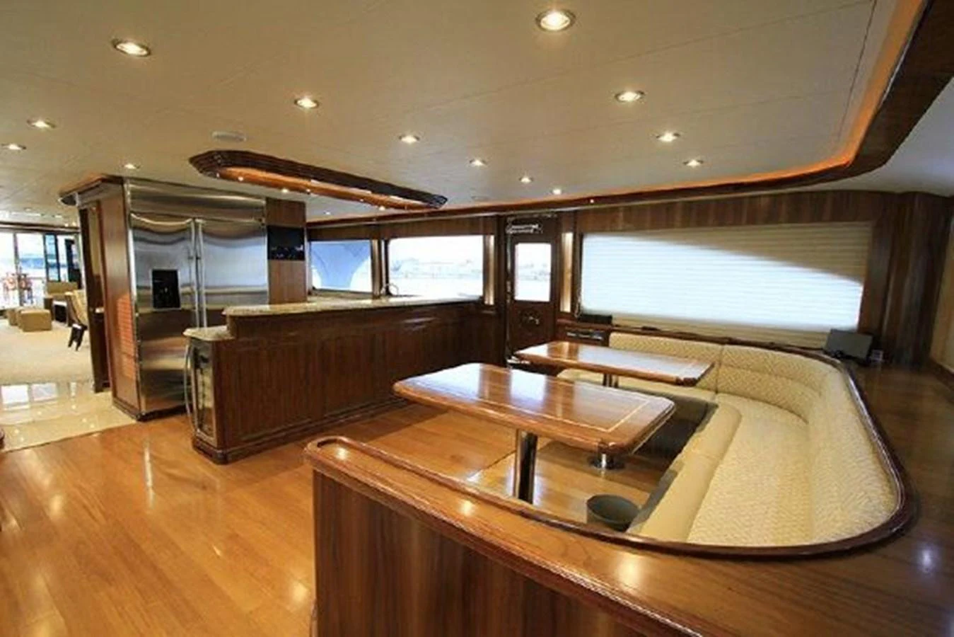 a room with a table and chairs aboard WHITE LOTUS Yacht for Sale