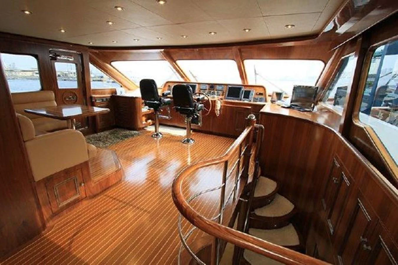 inside of a vehicle with wooden seats aboard WHITE LOTUS Yacht for Sale