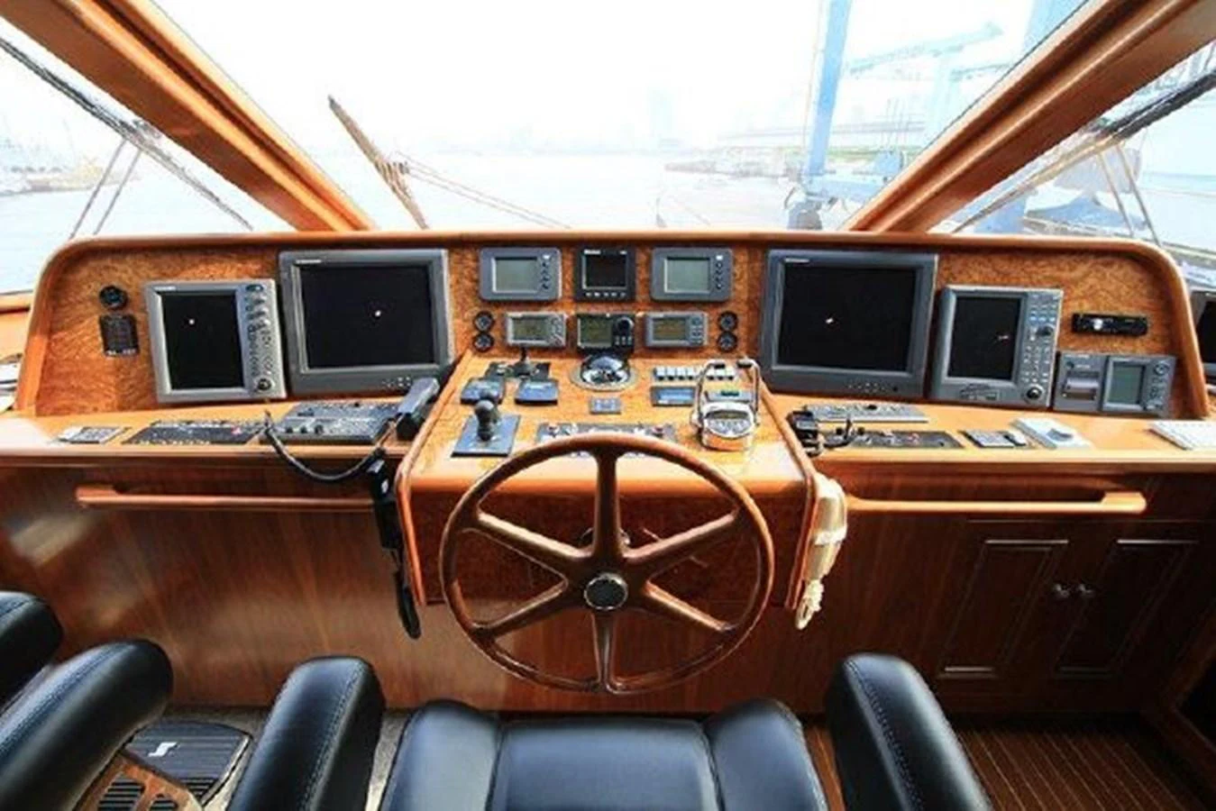 a group of monitors on a table aboard WHITE LOTUS Yacht for Sale