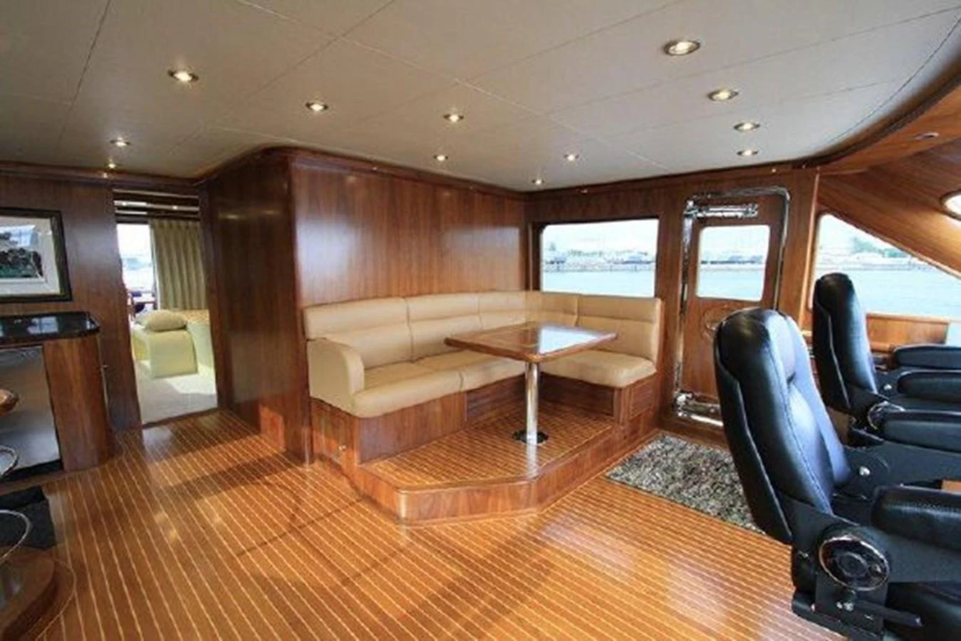 a living room with a wood floor aboard WHITE LOTUS Yacht for Sale