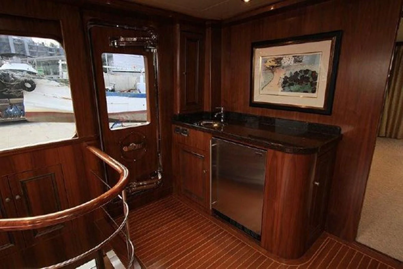 a kitchen with a wood cabinet aboard WHITE LOTUS Yacht for Sale