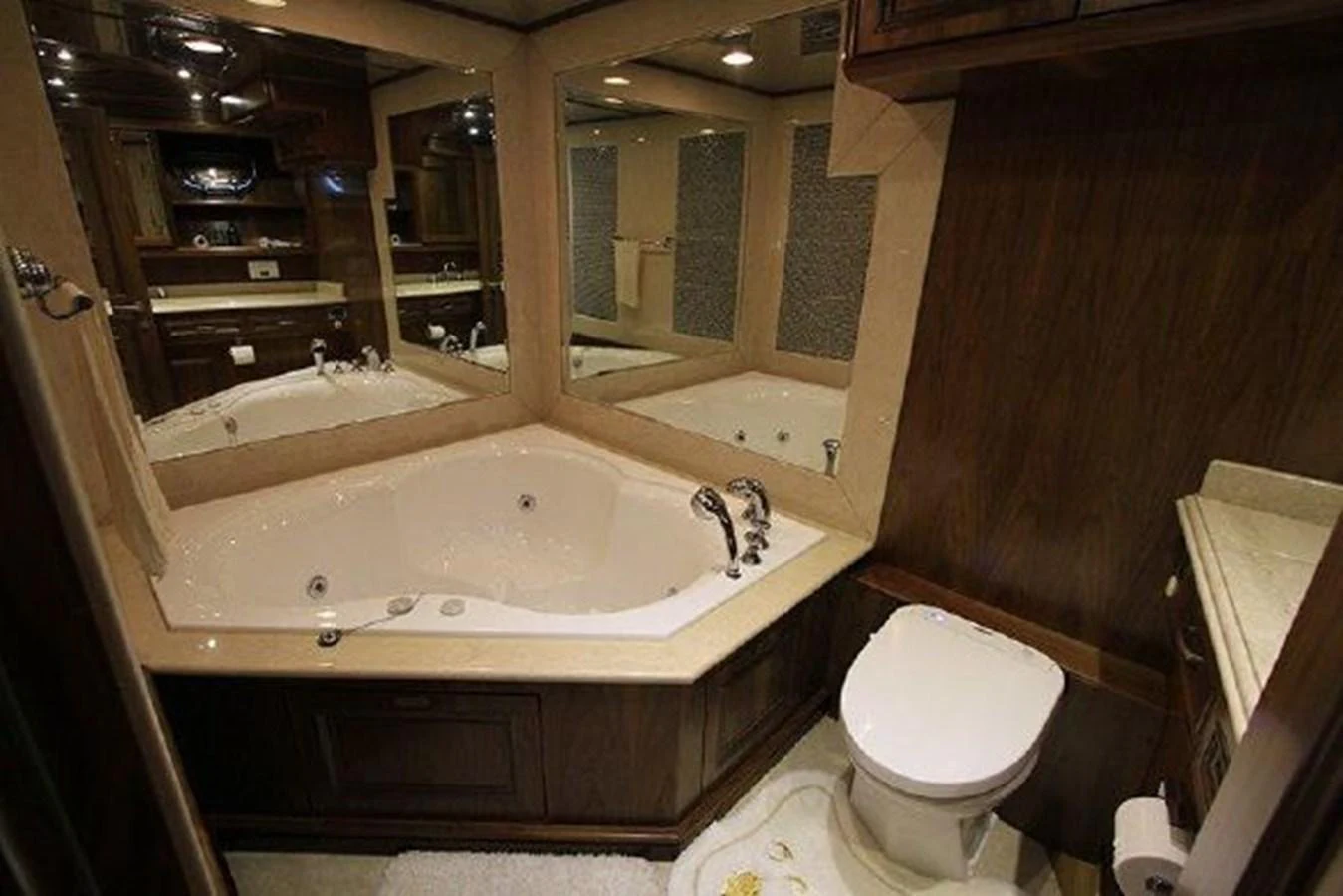 a bathroom with a tub sink and toilet aboard WHITE LOTUS Yacht for Sale