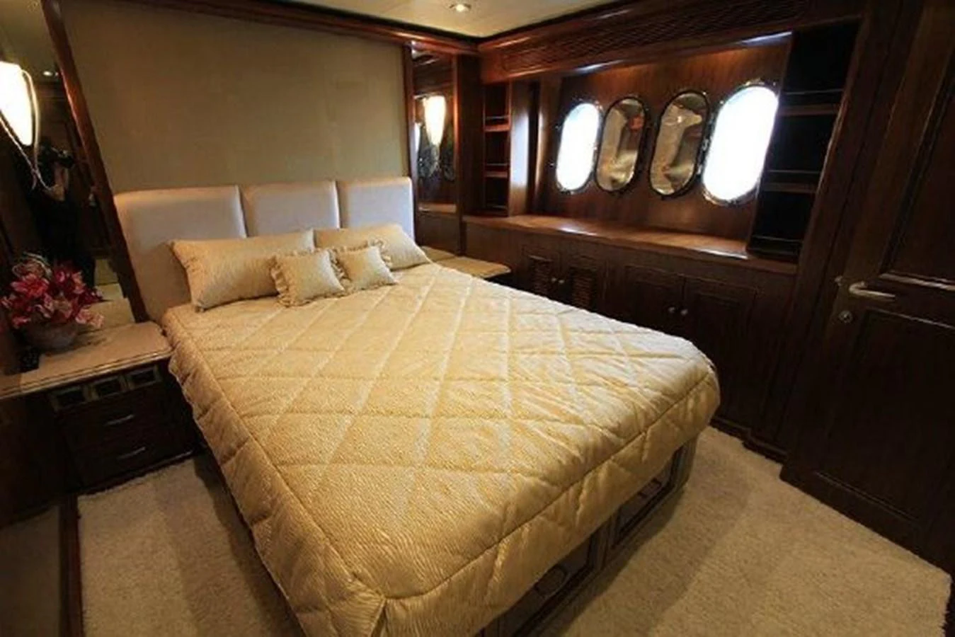 a bed with a mirror above it aboard WHITE LOTUS Yacht for Sale