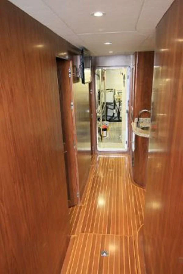 a hallway with wood walls aboard WHITE LOTUS Yacht for Sale