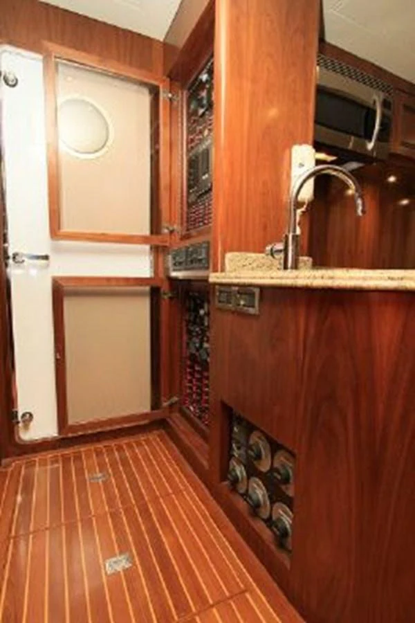 a kitchen with a sink and a microwave aboard WHITE LOTUS Yacht for Sale