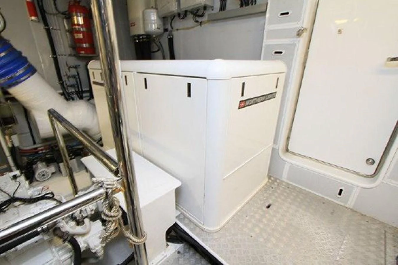 a white machine in a room aboard WHITE LOTUS Yacht for Sale