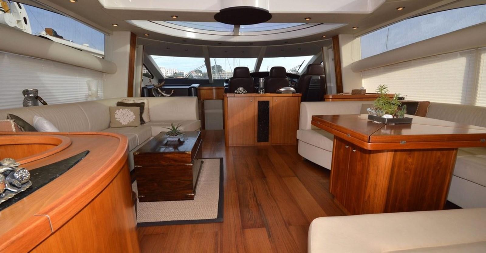 a room with a table and chairs aboard VA VA VROOM Yacht for Sale
