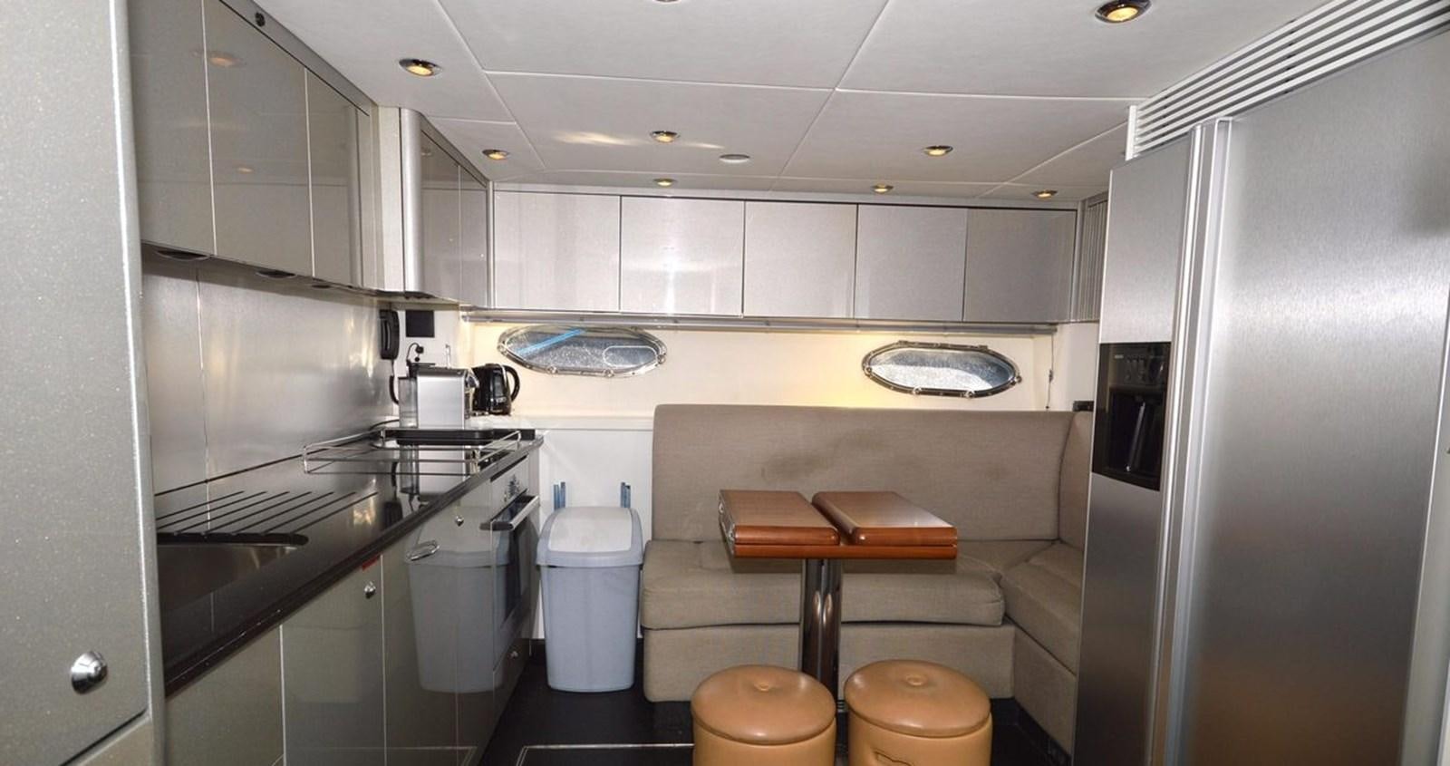 a kitchen with a sink and a refrigerator aboard VA VA VROOM Yacht for Sale